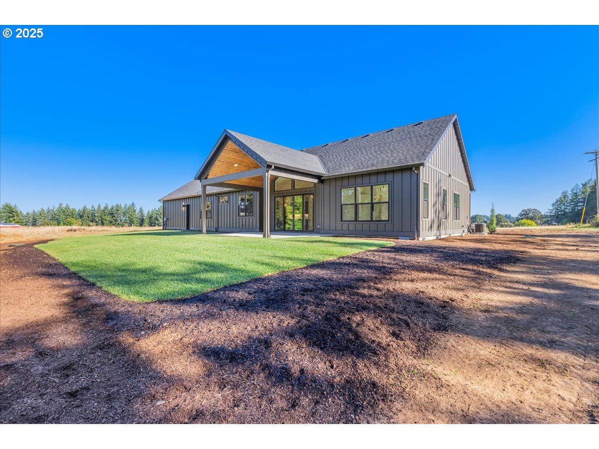 7168 Southeast Eola Hills Road Amity, OR 97101 - Photo 31 of 34 a front view of a house with a yard