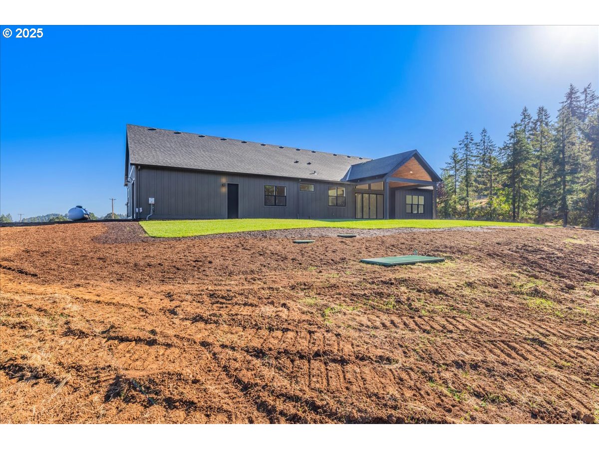 7168 Southeast Eola Hills Road Amity, OR 97101 - Photo 33 of 34 a house with a yard