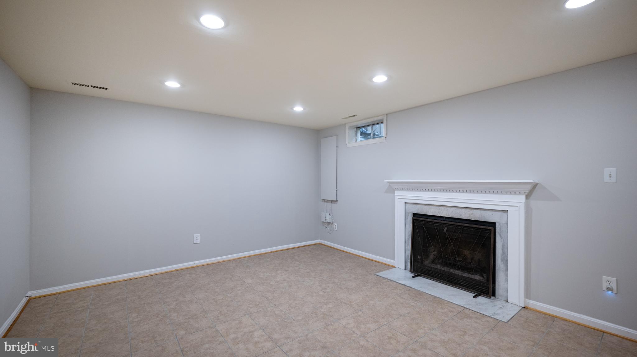 2210 Wimbledon Circle Silver Spring, MD 20906 - Photo 23 of 29 Rec Room with Fireplace