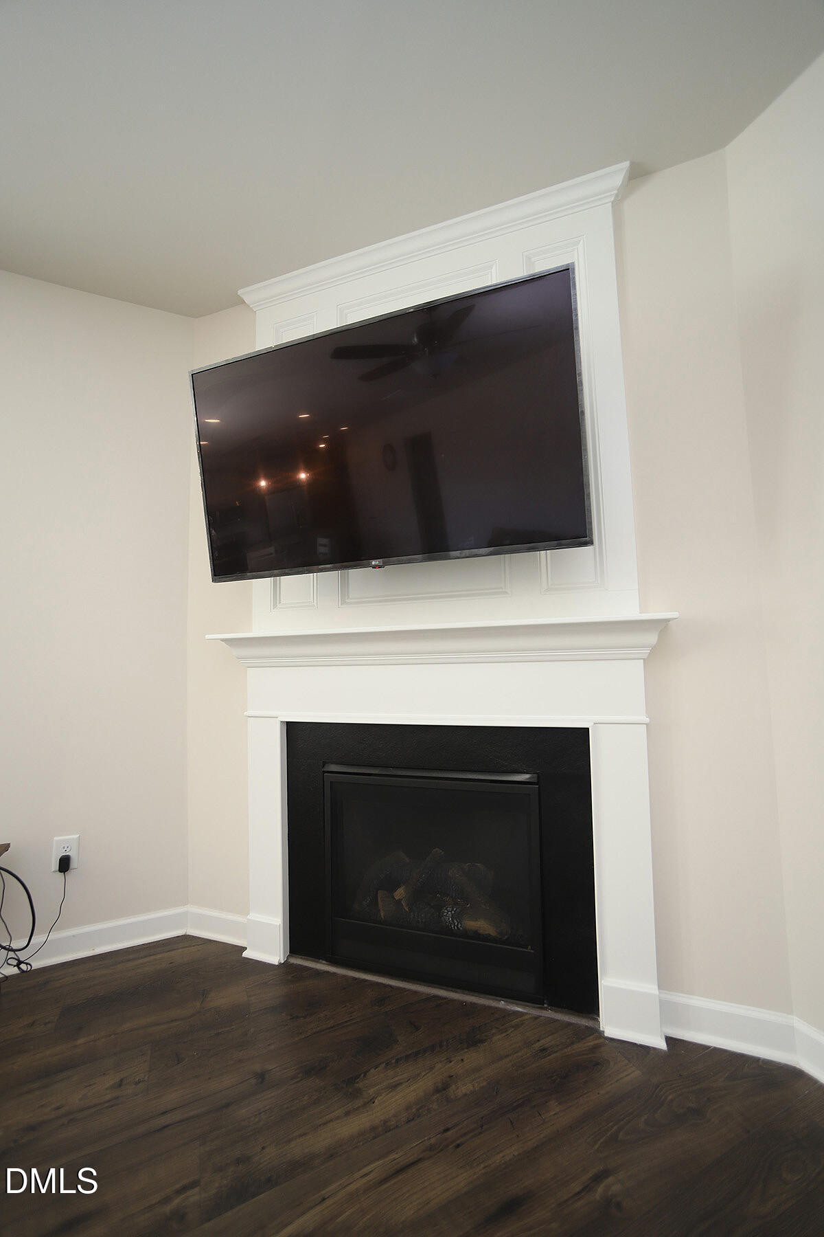 125 Mae Court Roxboro, NC 27573 - Photo 13 of 30 a living room with a fireplace and wooden floor