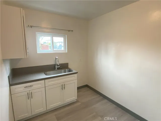 a kitchen with a sink and cabinets