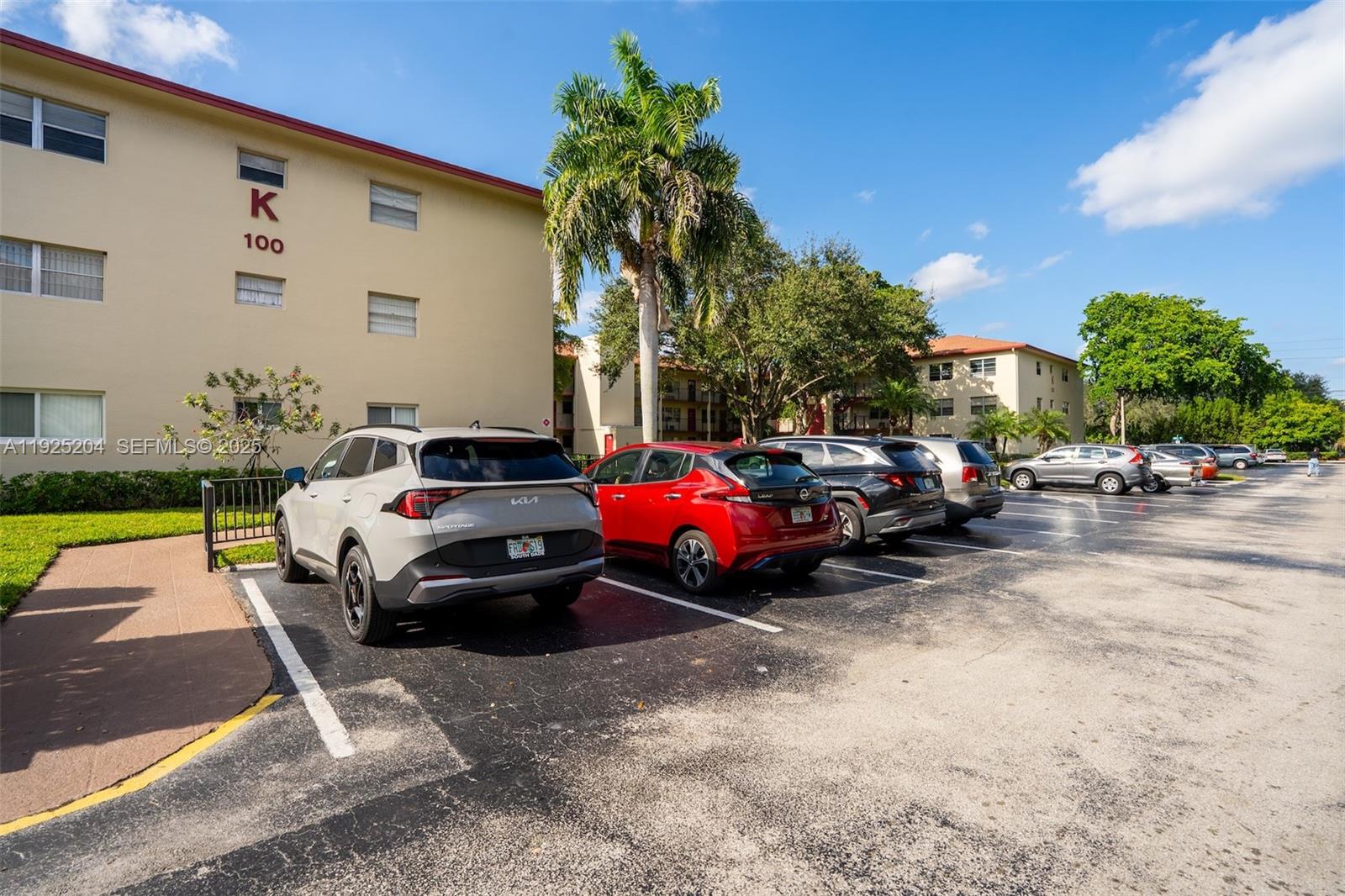 100 Southwest 132nd Way, Unit 306K Pembroke Pines, FL 33027 - Photo 21 of 31 a car parked in front of a house
