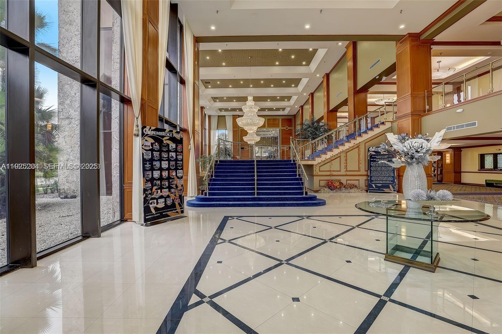 100 Southwest 132nd Way, Unit 306K Pembroke Pines, FL 33027 - Photo 30 of 31 a view of stairs and with wooden floor