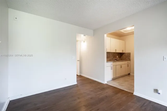 a view of kitchen and wooden floor