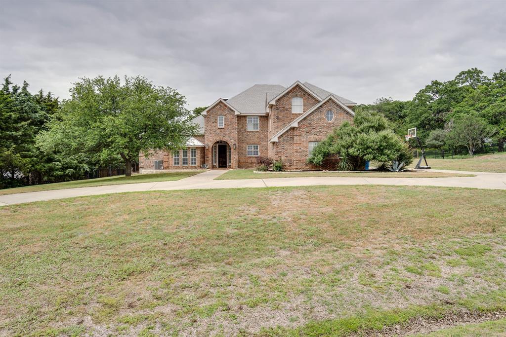 120 Maple Leaf Drive Double Oak, TX 75077 - Photo 1 of 1 a front view of a house with a yard and trees
