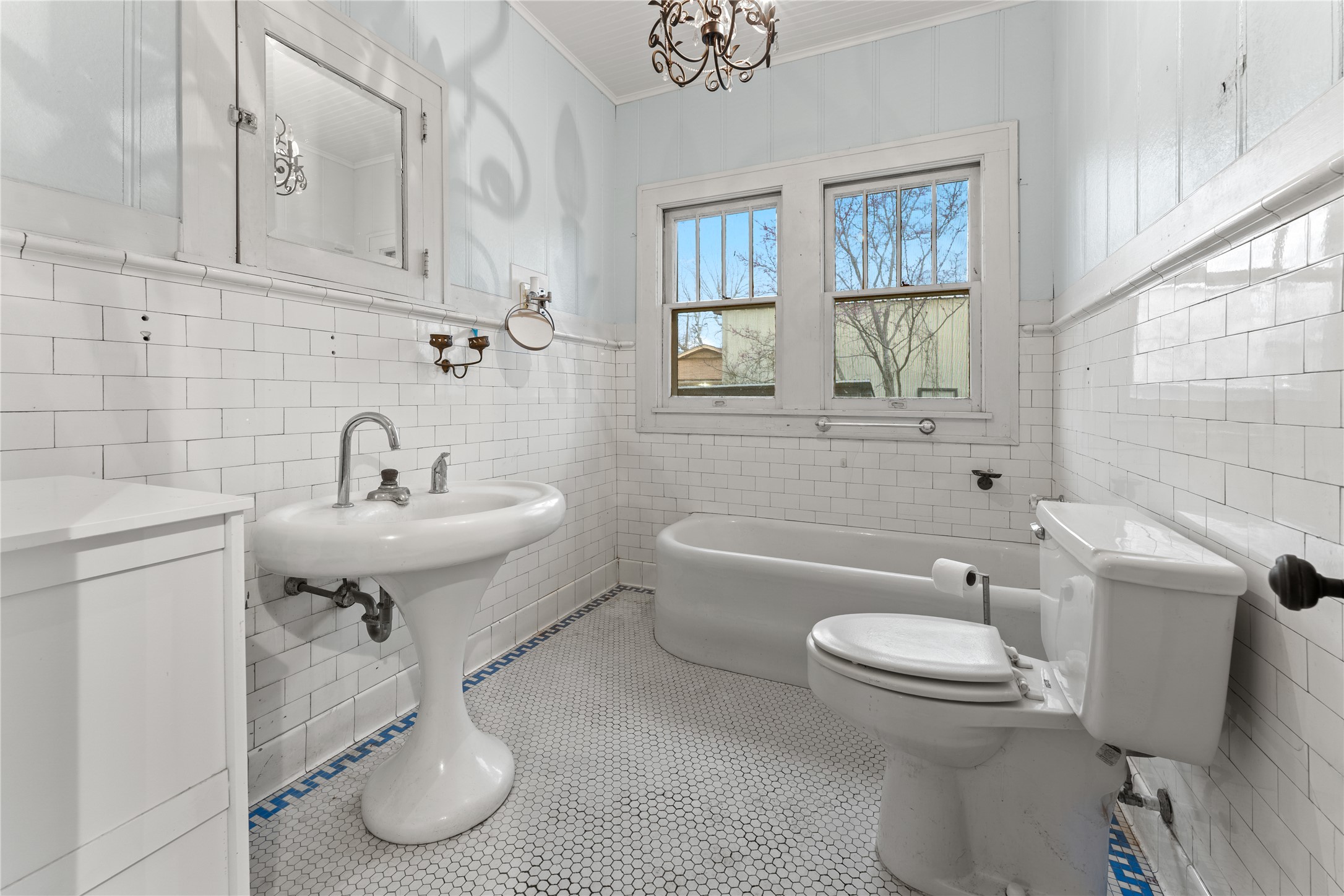 501 East 6th Street Cameron, TX 76520 - Photo 29 of 39 Bathroom featuring toilet, tile walls, ornamental molding, and tile patterned flooring