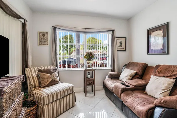 a living room with furniture and windows