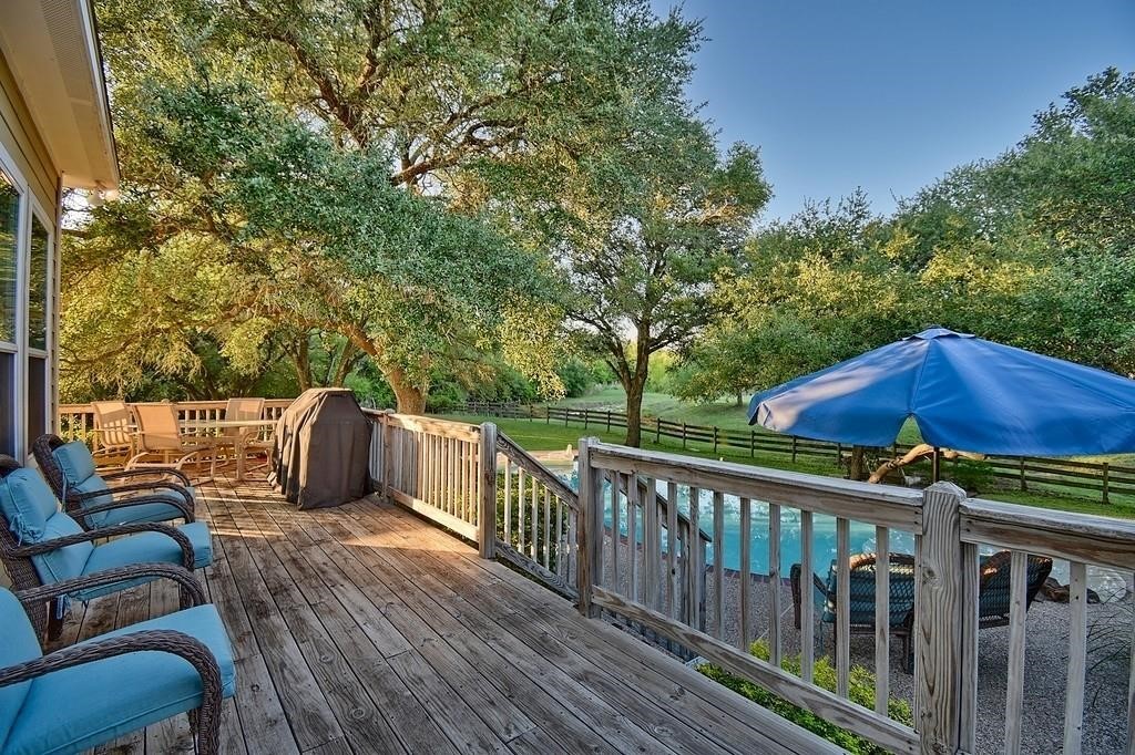 8456 Schuster Road Ledbetter, TX 78946 - Photo 35 of 49 a view of a wooden deck with furniture