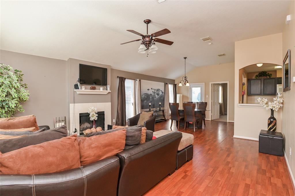 18446 South Wimbledon Drive Katy, TX 77449 - Photo 8 of 24 a living room with fireplace furniture and a flat screen tv
