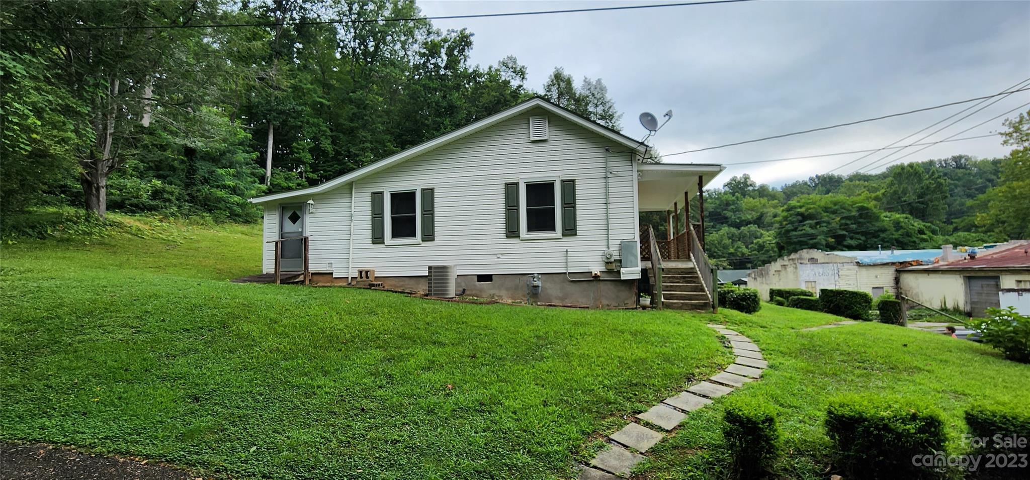 19 Rector Street Tryon, NC 28782 - Photo 8 of 26 a view of a house with a yard