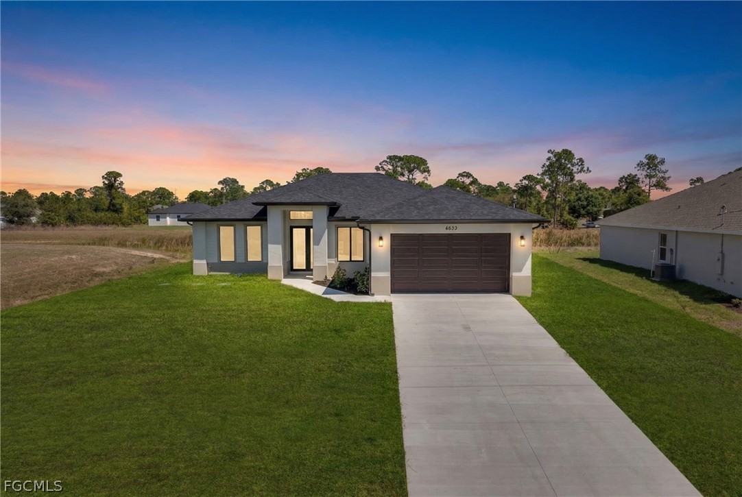 6029 Keystone Circle LaBelle, FL 33935 - Photo 2 of 50 a front view of a house with a yard