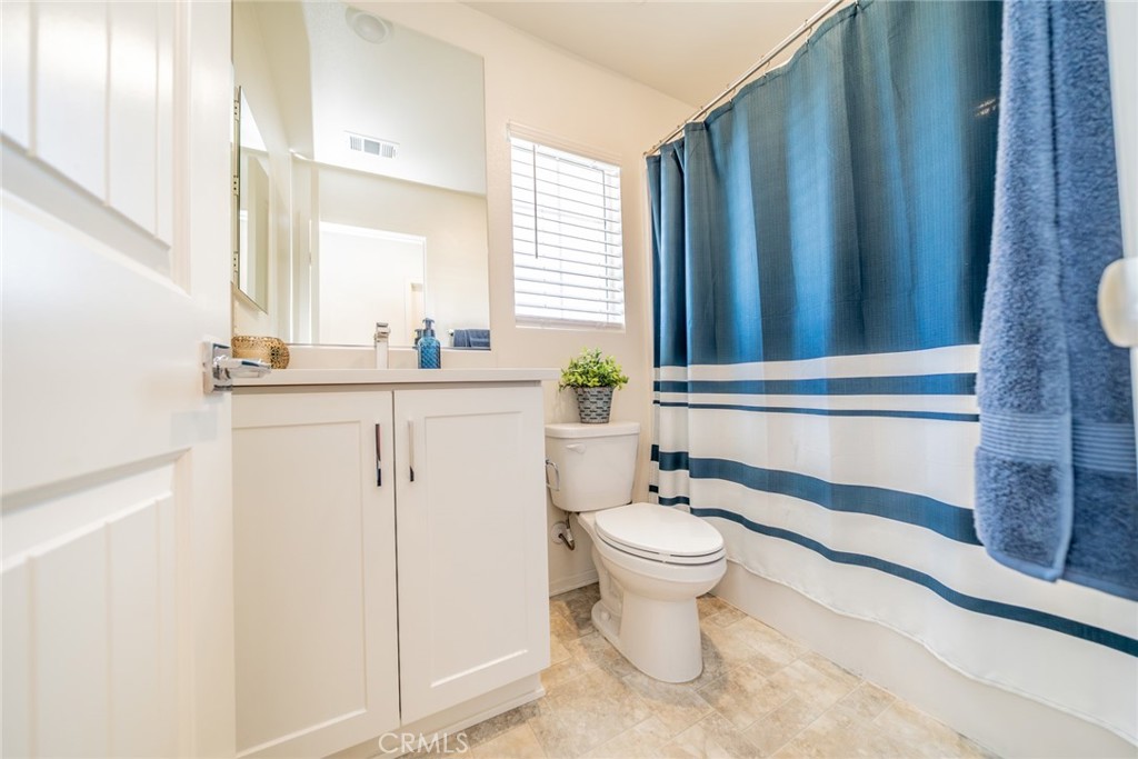 1810 Parkplace Lane Riverside, CA 92501 - Photo 22 of 52 a bathroom with a sink toilet and window