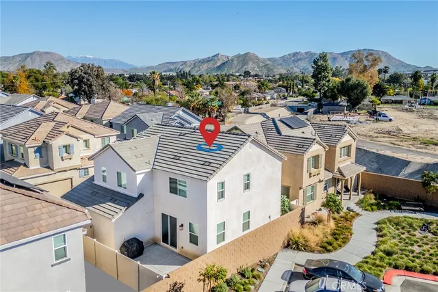 an aerial view of residential houses with outdoor space
