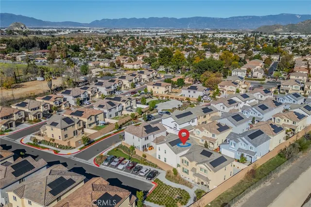 an aerial view of residential houses with outdoor space