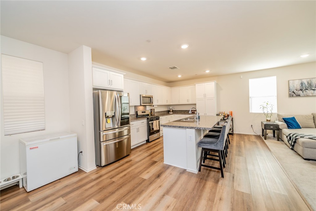 1810 Parkplace Lane Riverside, CA 92501 - Photo 7 of 52 a kitchen with a sink appliances and cabinets