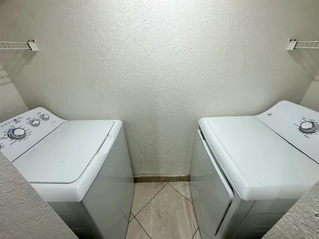 a utility room with dryer and washer
