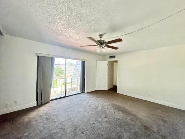 a bathroom with a double vanity sink a toilet and a mirror