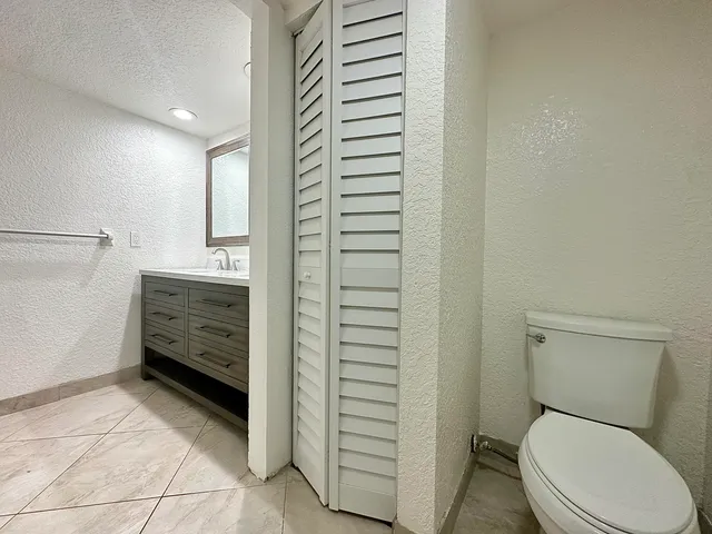 a bathroom with a sink and toilet