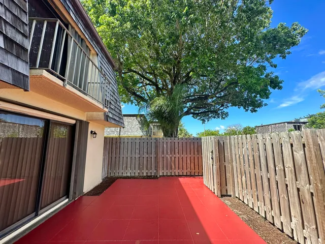 a balcony with trees in front of it