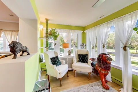 a view of a dining room with furniture window and outside view