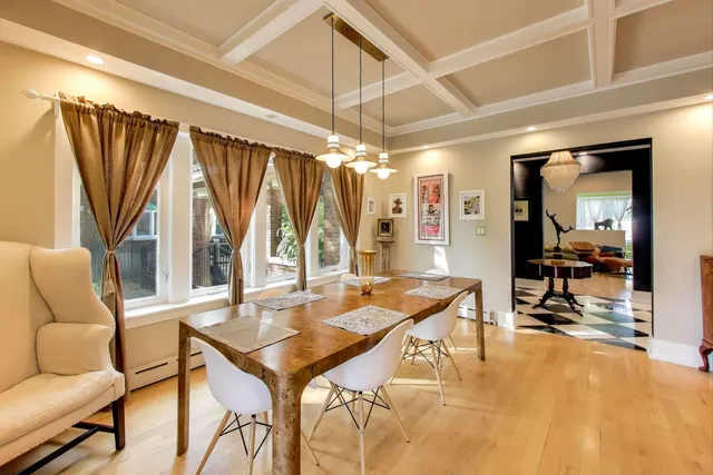 a living room with lots of furniture and kitchen view
