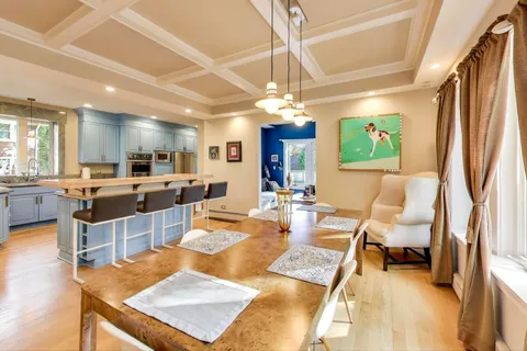a kitchen with stainless steel appliances granite countertop a sink and a refrigerator