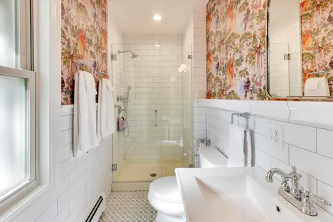 a view of a livingroom with furniture and a hallway