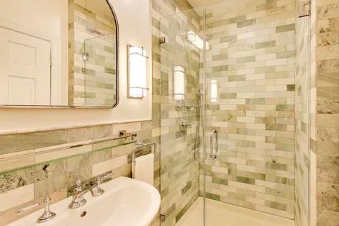 a bathroom with a sink a vanity and a mirror