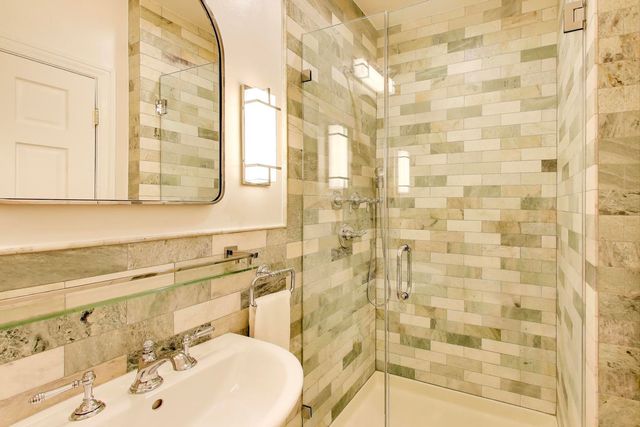 a bathroom with a sink a vanity and a mirror