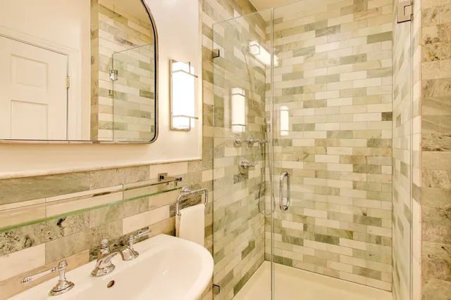 a bathroom with a sink a vanity and a mirror