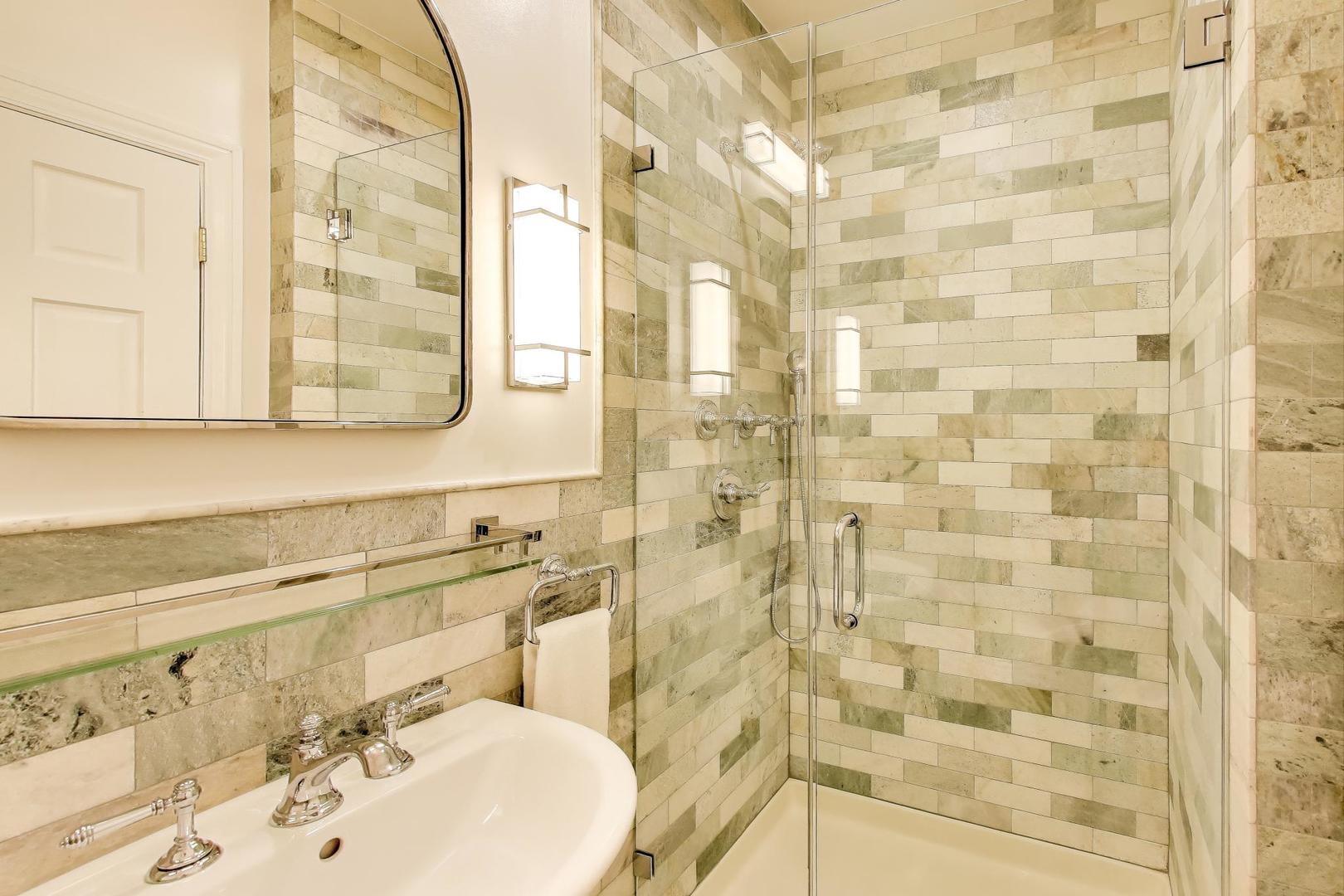 823 Jackson Avenue River Forest, IL 60305 - Photo 33 of 60 a bathroom with a sink a mirror and a shower