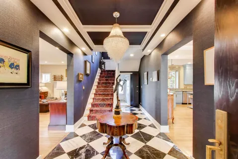 a view of entryway and hall with dining area