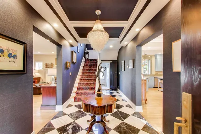 a view of entryway and hall with dining area