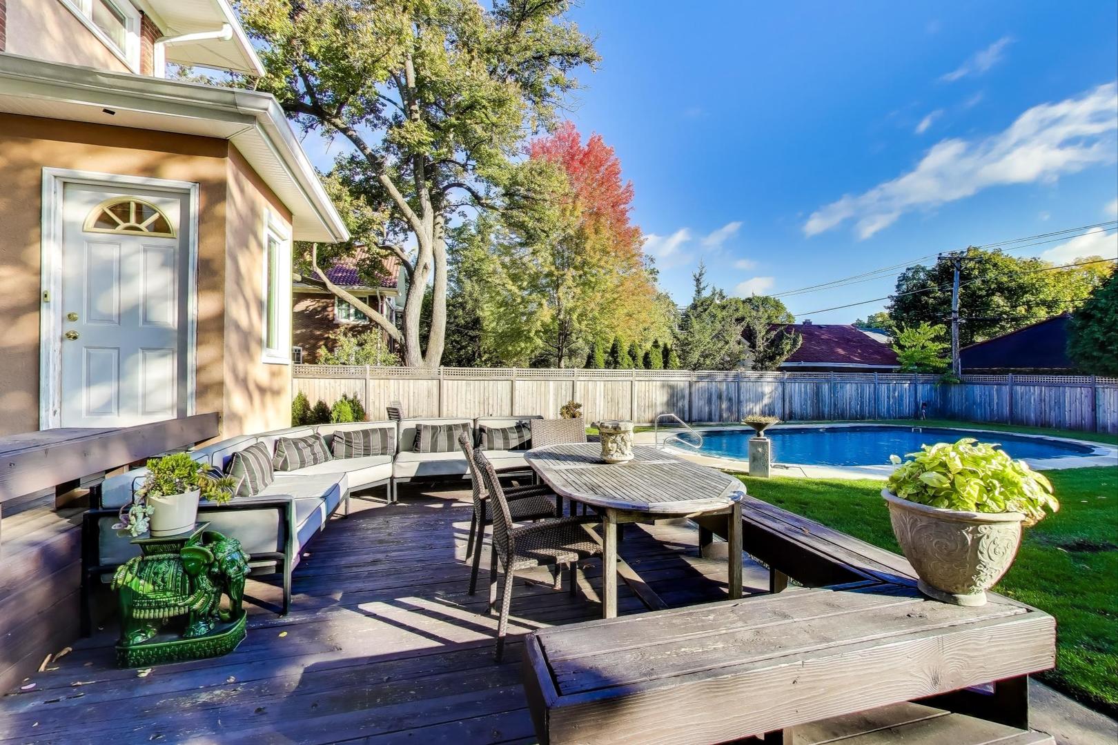 823 Jackson Avenue River Forest, IL 60305 - Photo 46 of 60 a view of a patio with table and chairs potted plants with wooden fence