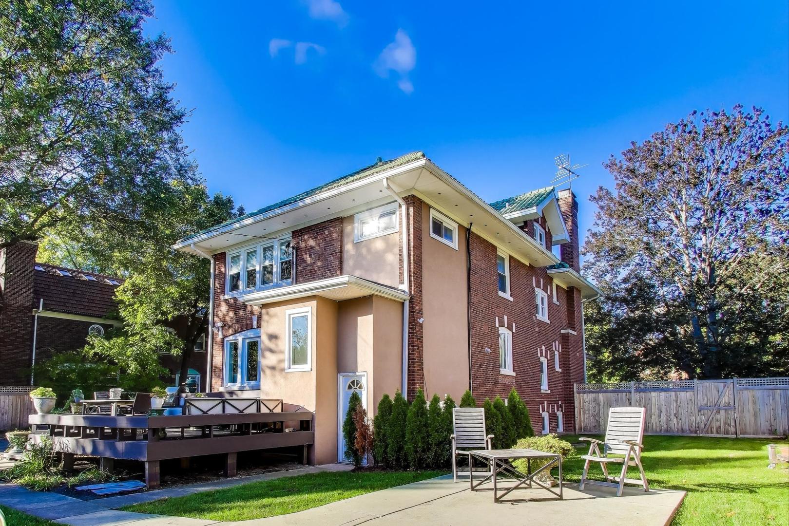 823 Jackson Avenue River Forest, IL 60305 - Photo 49 of 60 a front view of a house with a garden and sitting area