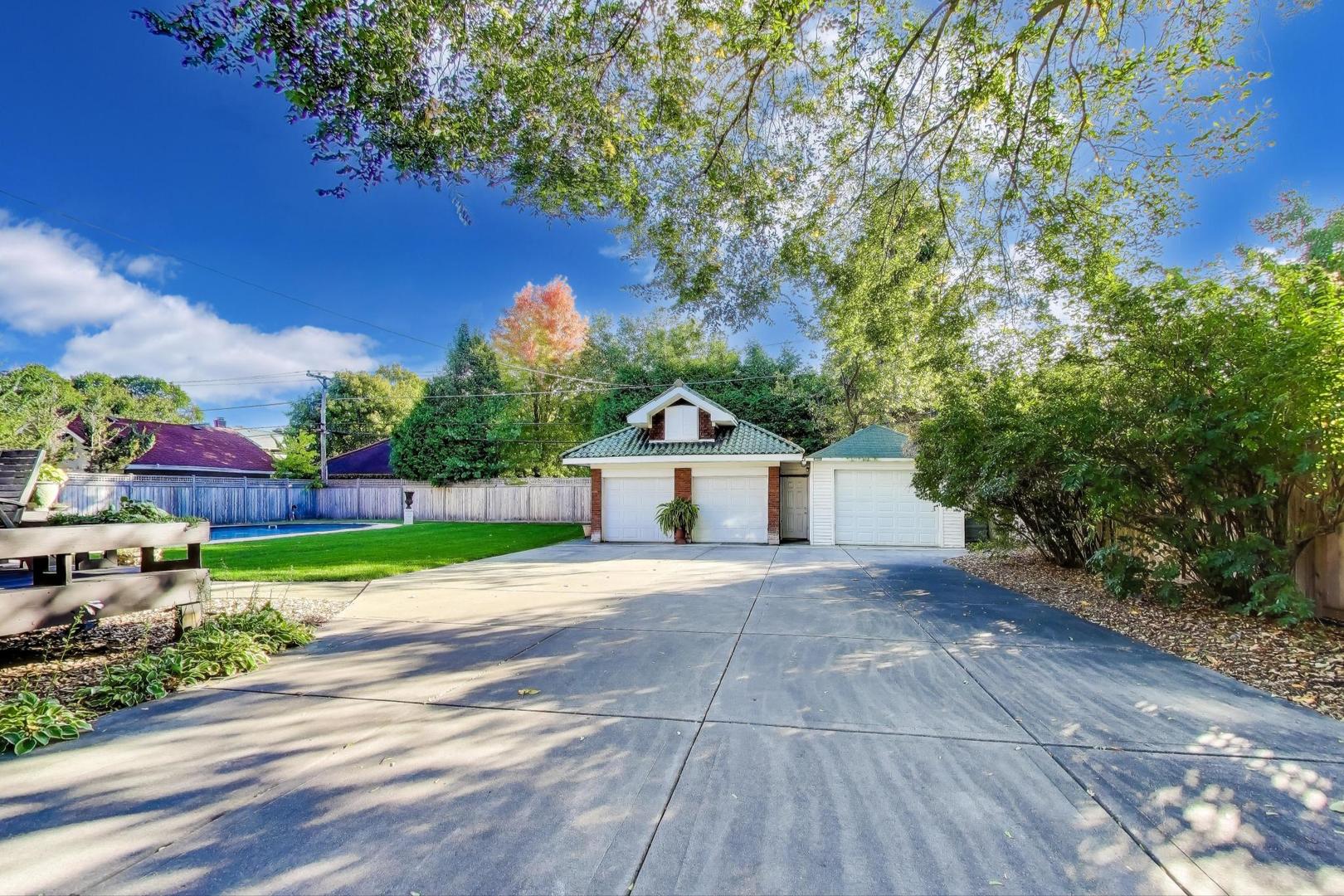 823 Jackson Avenue River Forest, IL 60305 - Photo 56 of 60 a front view of a house with a yard and garage