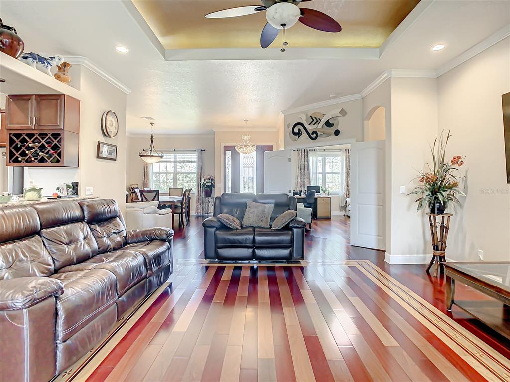 16300 Johns Lake Road Clermont, FL 34711 - Photo 18 of 76 a living room with furniture and a chandelier