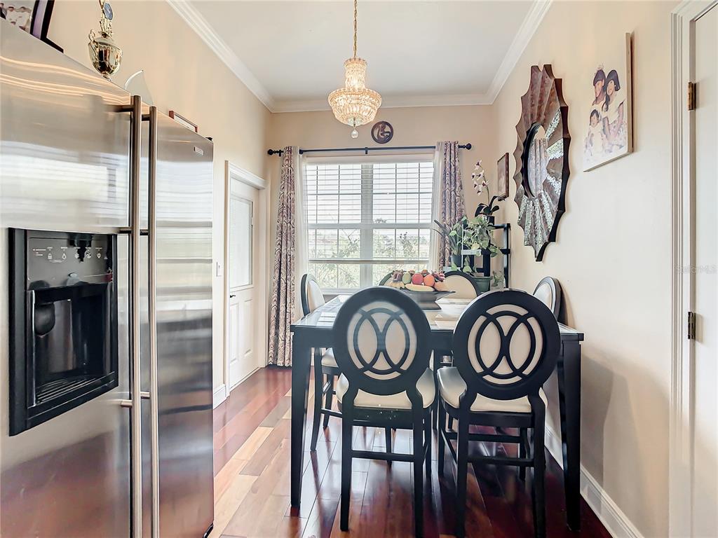 16300 Johns Lake Road Clermont, FL 34711 - Photo 21 of 76 a view of a dining room with furniture window and wooden floor