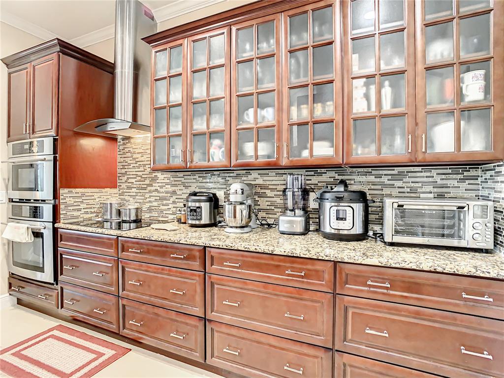 16300 Johns Lake Road Clermont, FL 34711 - Photo 30 of 76 a kitchen with stainless steel appliances granite countertop a sink and cabinets