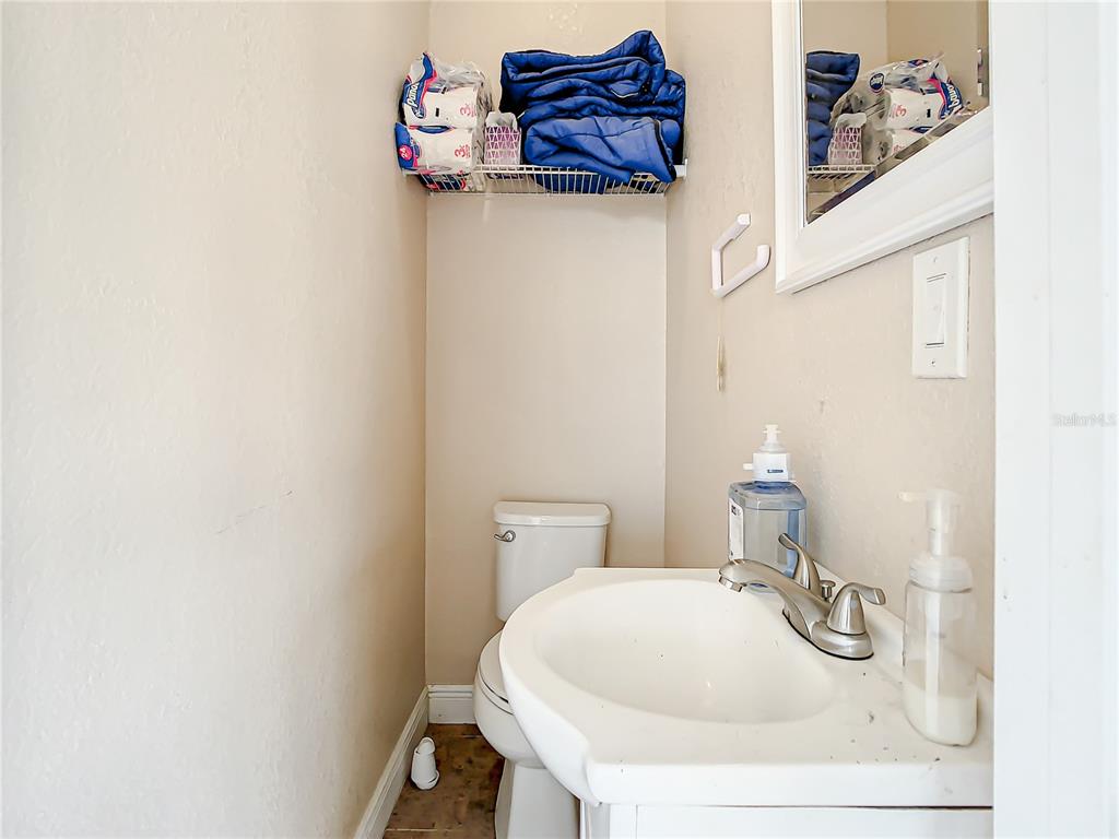 16300 Johns Lake Road Clermont, FL 34711 - Photo 59 of 76 a bathroom with a sink and a toilet