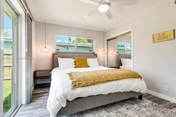 a bedroom with a bed and window