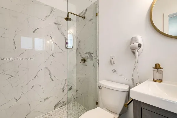 a bathroom with a toilet and a sink