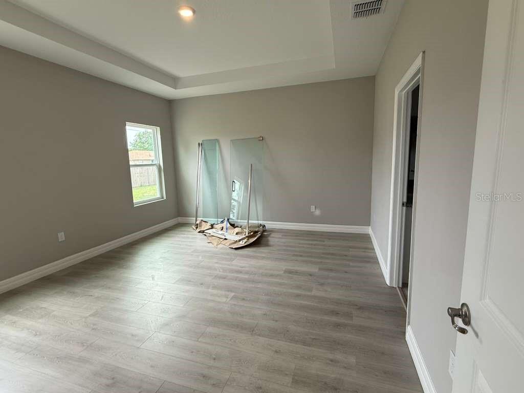 438 Awin Circle Southeast Palm Bay, FL 32909 - Photo 19 of 26 an empty room with windows