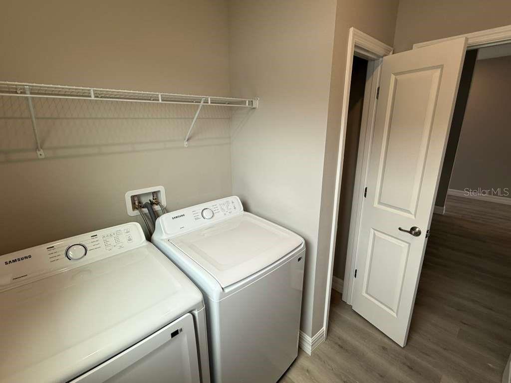 438 Awin Circle Southeast Palm Bay, FL 32909 - Photo 22 of 26 a utility room with dryer and washer