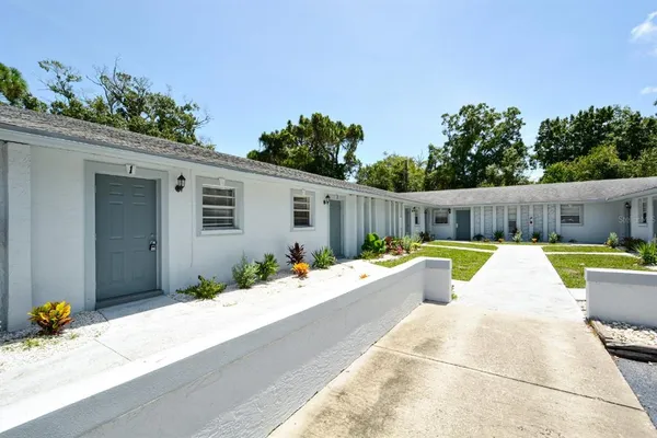a swimming pool with outdoor seating and yard