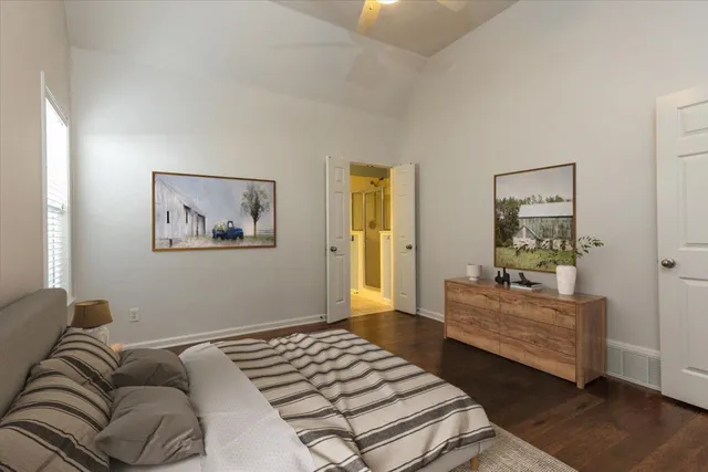 a bedroom with furniture and window