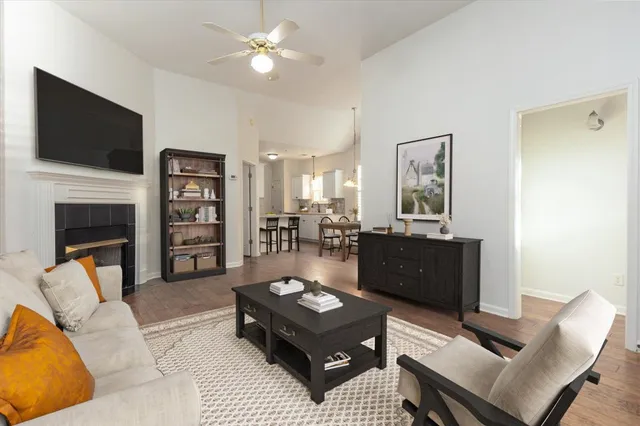 a living room with furniture and a flat screen tv