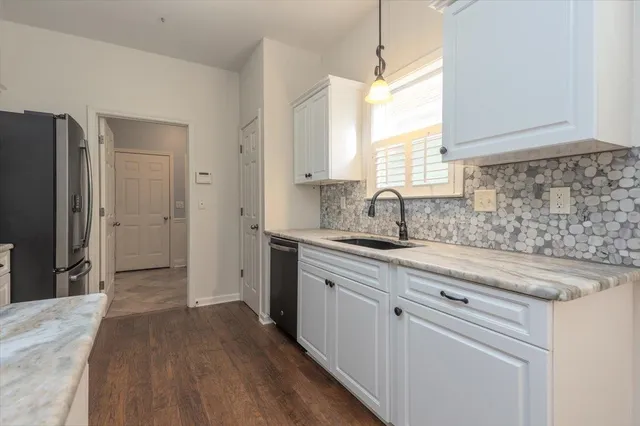a kitchen with sink cabinets and window