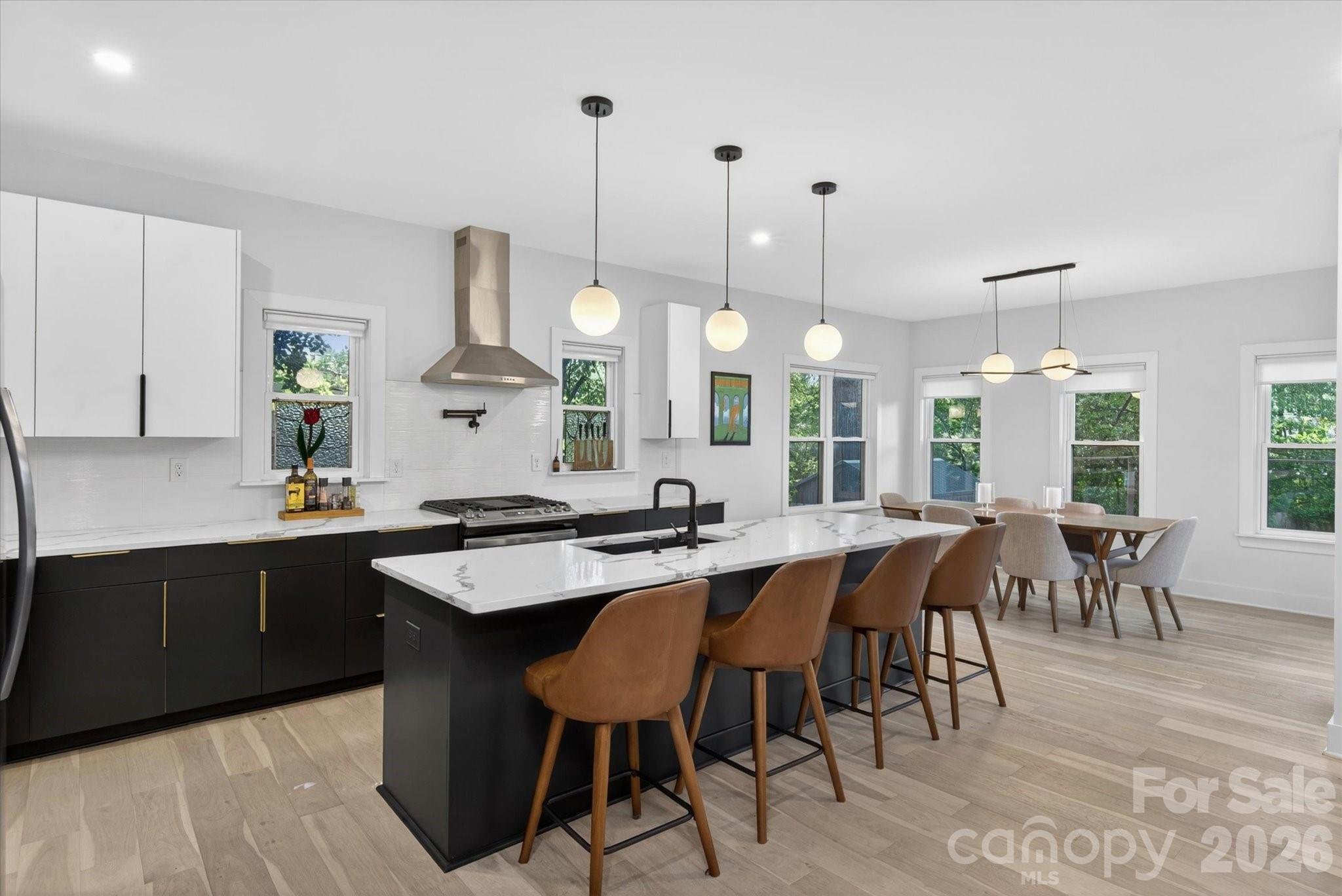 1608 Chippendale Road Charlotte, NC 28205 - Photo 20 of 46 a kitchen with lots of counter space dining table and chairs