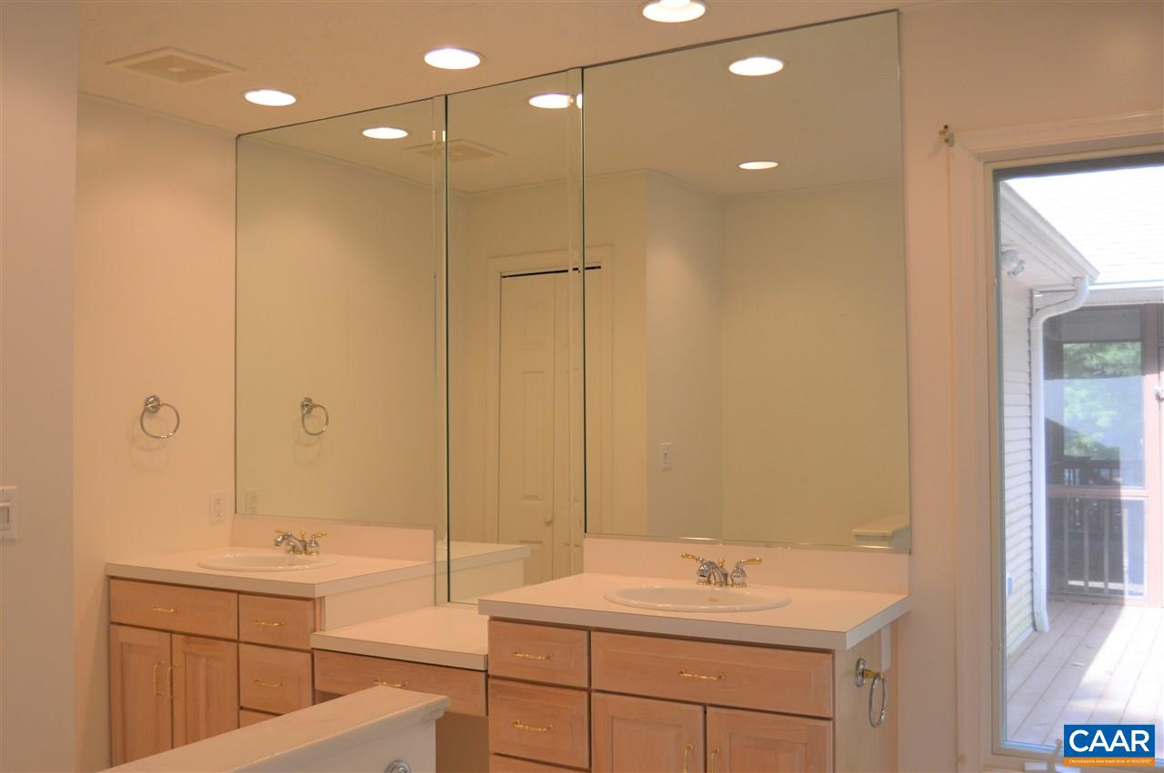 17 Oak Grove Road Palmyra, VA 22963 - Photo 14 of 24 a bathroom with a sink a toilet and shower